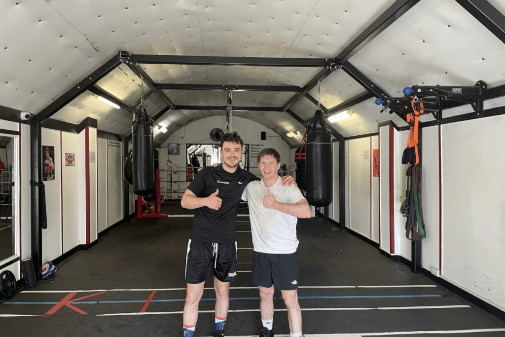 Coach Petrut with Jake after the session. White sweaty t shirt as after a hard session. Thumbs up as all is fine training with Coach Petrut.